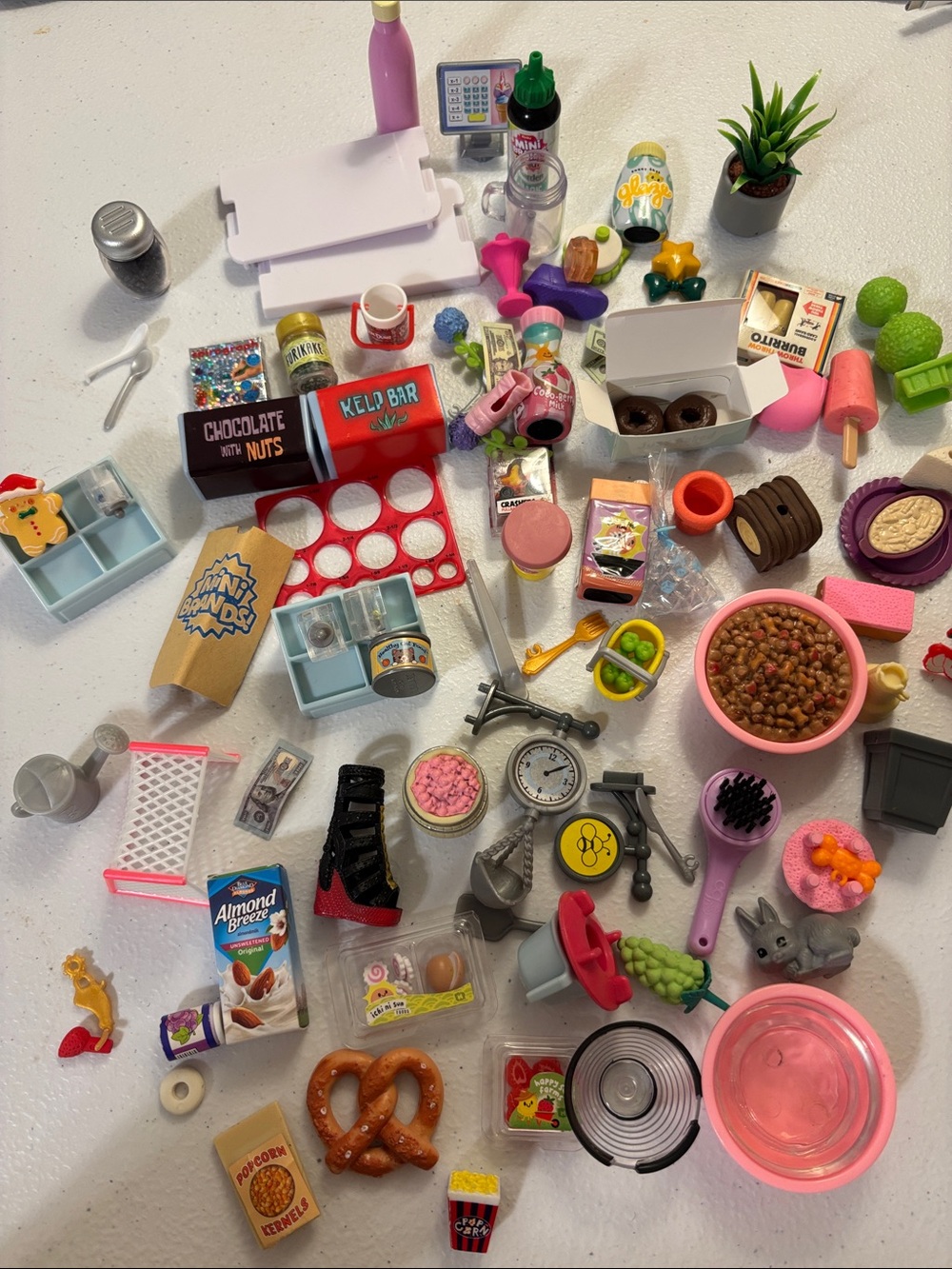 Bundle of Mini Brands and Doll House Items